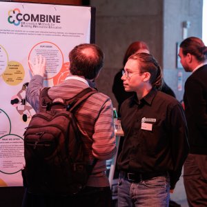 Participants in conversation with one another at the information market