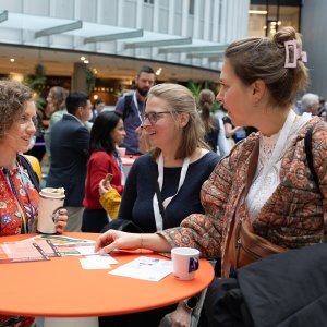 People in conversation at NOSF