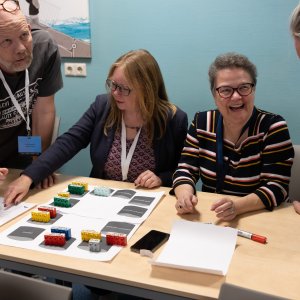 A group of people attending the third workshop round